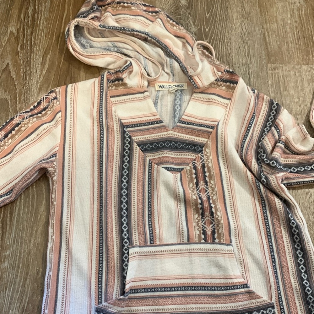 Small hooded long sleeve shirt.